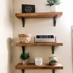 powder bathroom floating shelves