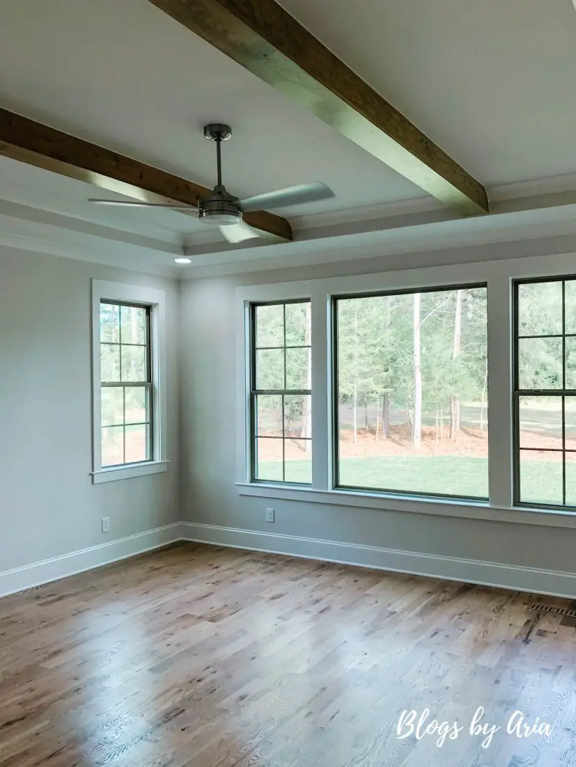 master bedroom with wood beams