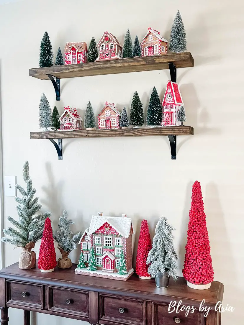 how to style floating shelves with gingerbread houses