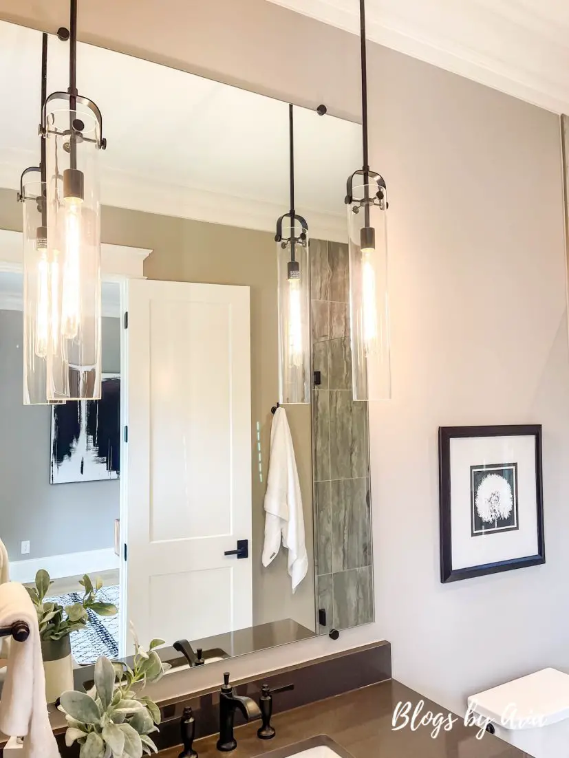 bathroom with hanging pendant lights