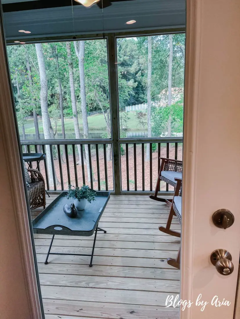 screened in porch with full view patio door and outdoor ceiling fan