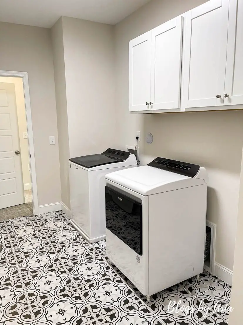 second floor laundry room with access to the owner's suite