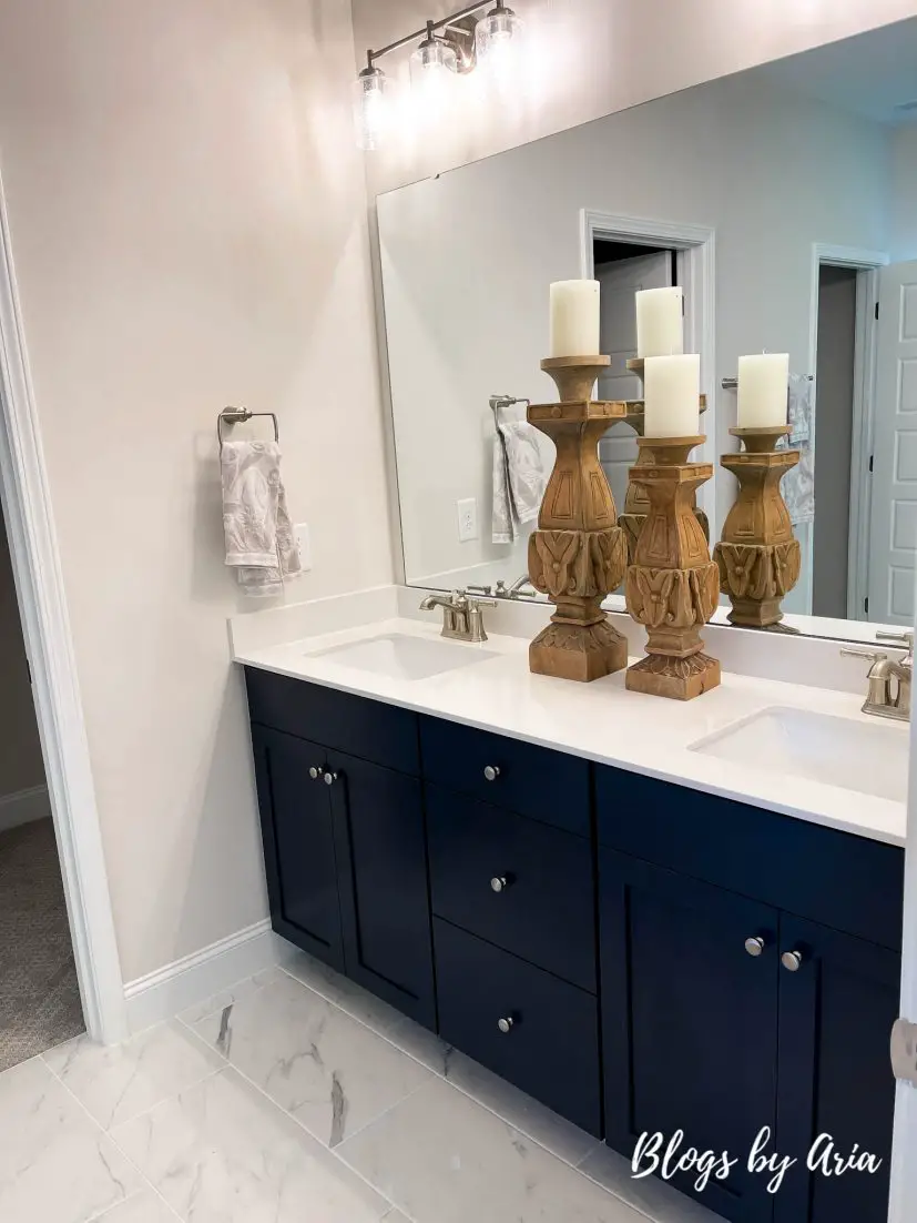 bathroom with navy blue cabinets