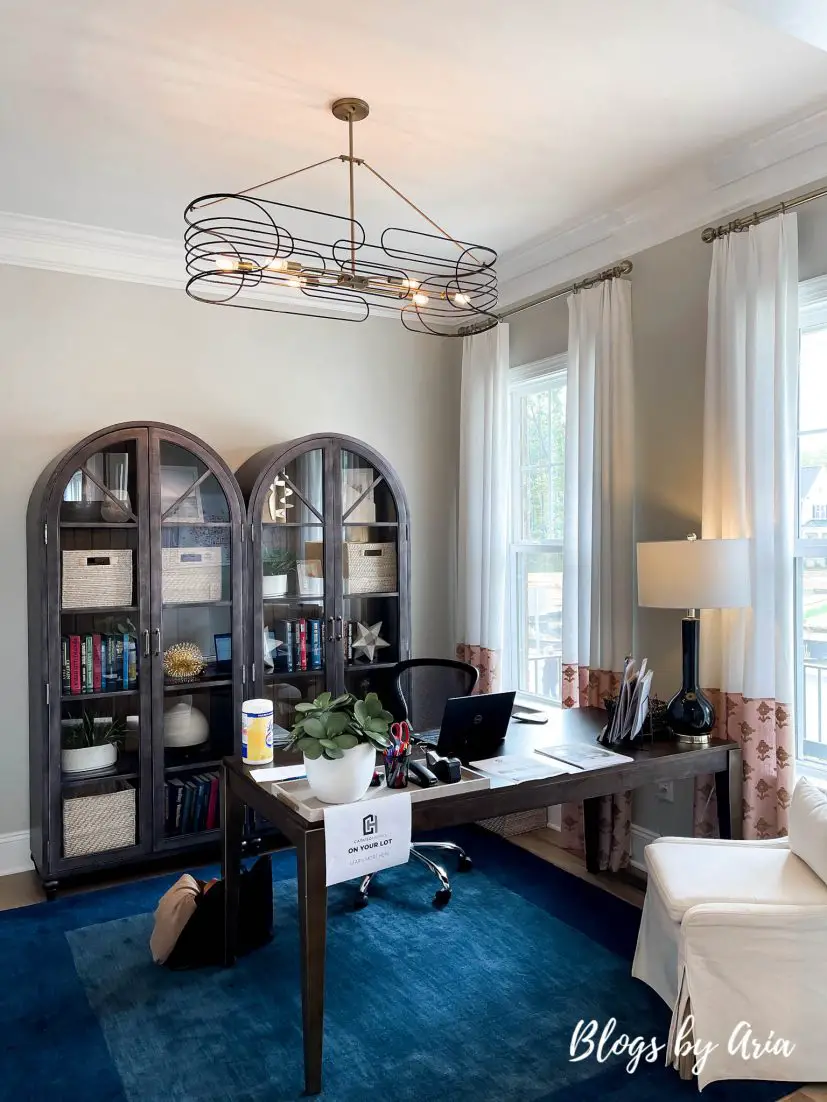 home office decorated with curved bookcases