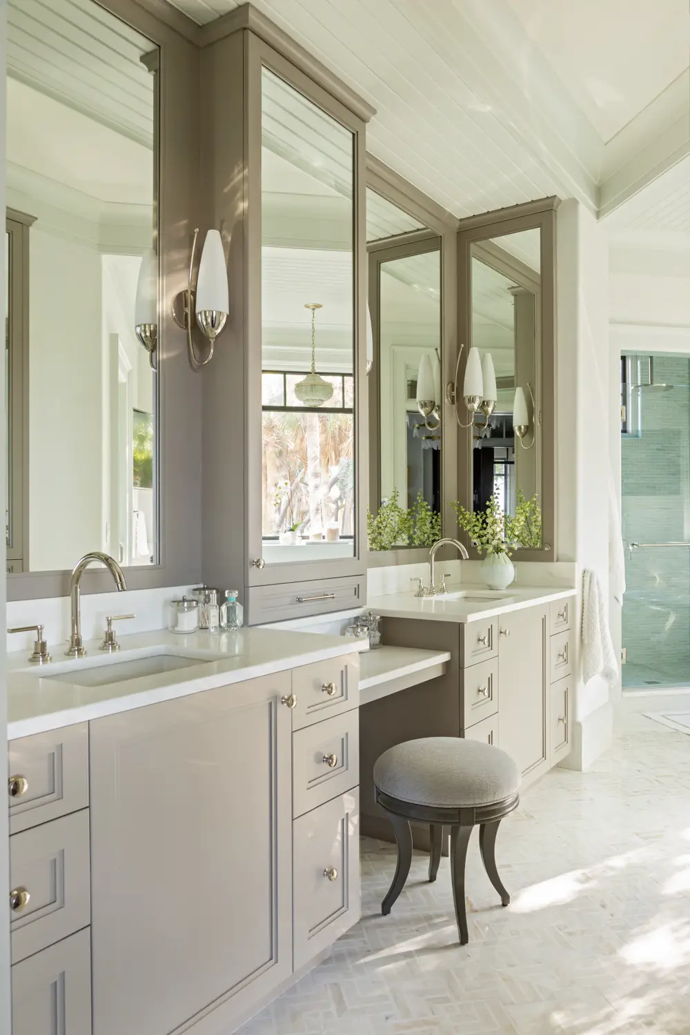 primary bathroom with mirrored cabinets