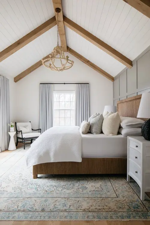 primary bedroom with vaulted planked ceilings