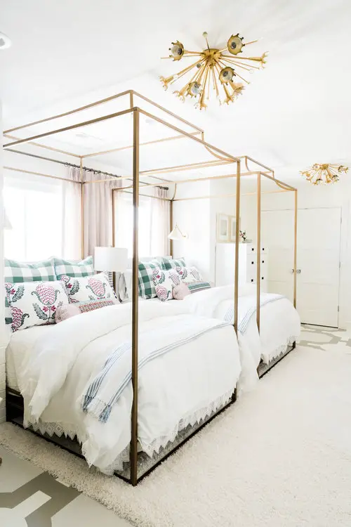 shared girls bedroom with canopy beds