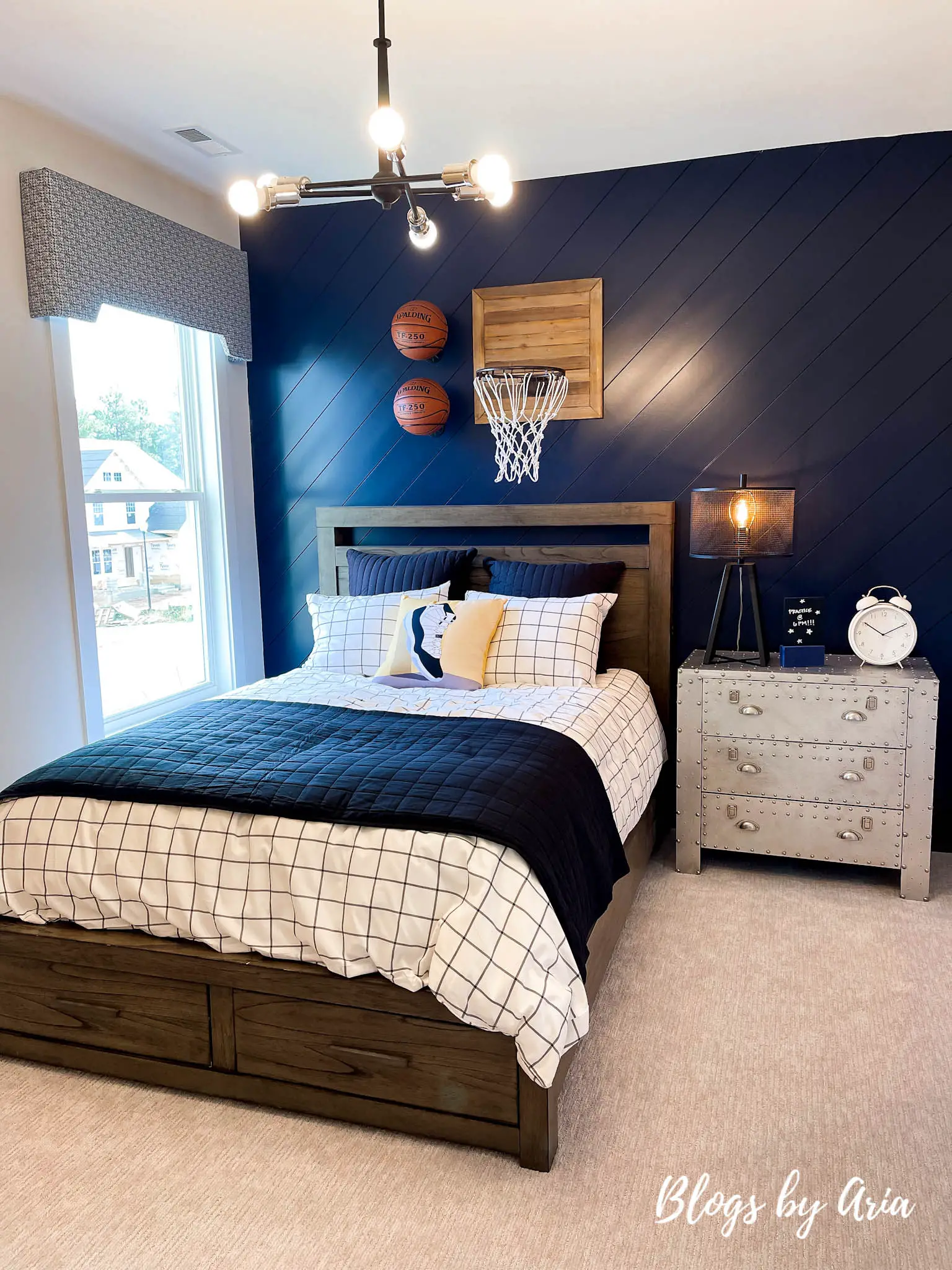 boys basketball themed bedroom with blue painted shiplap accent wall