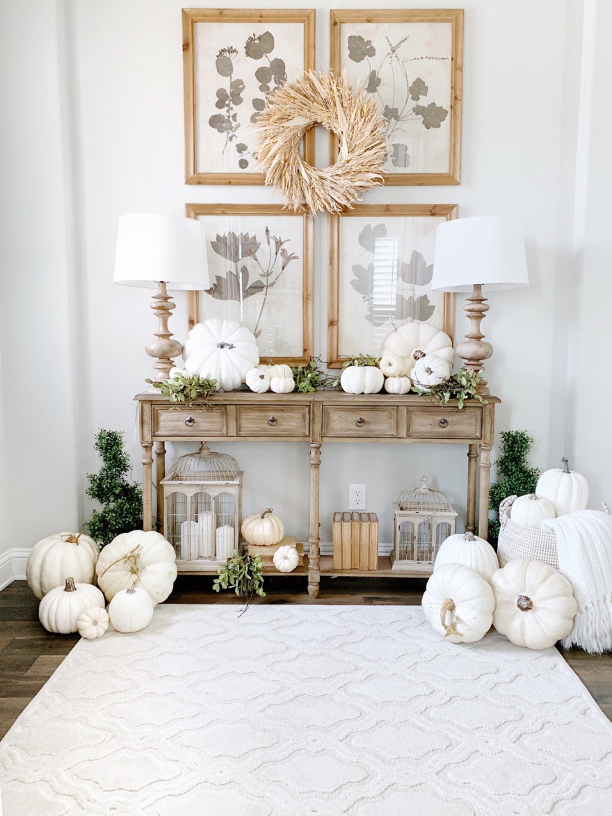 neutral fall styled console table with white pumpkins