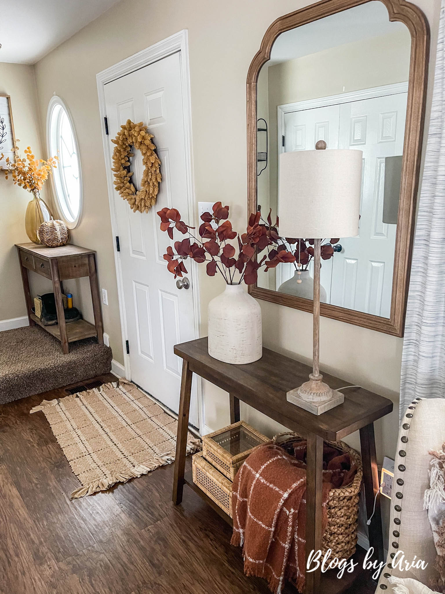 fall entryway small space entryway decorating for Fall with cream vase filled with beautiful brown stems and window pane fall throw blanket in basket