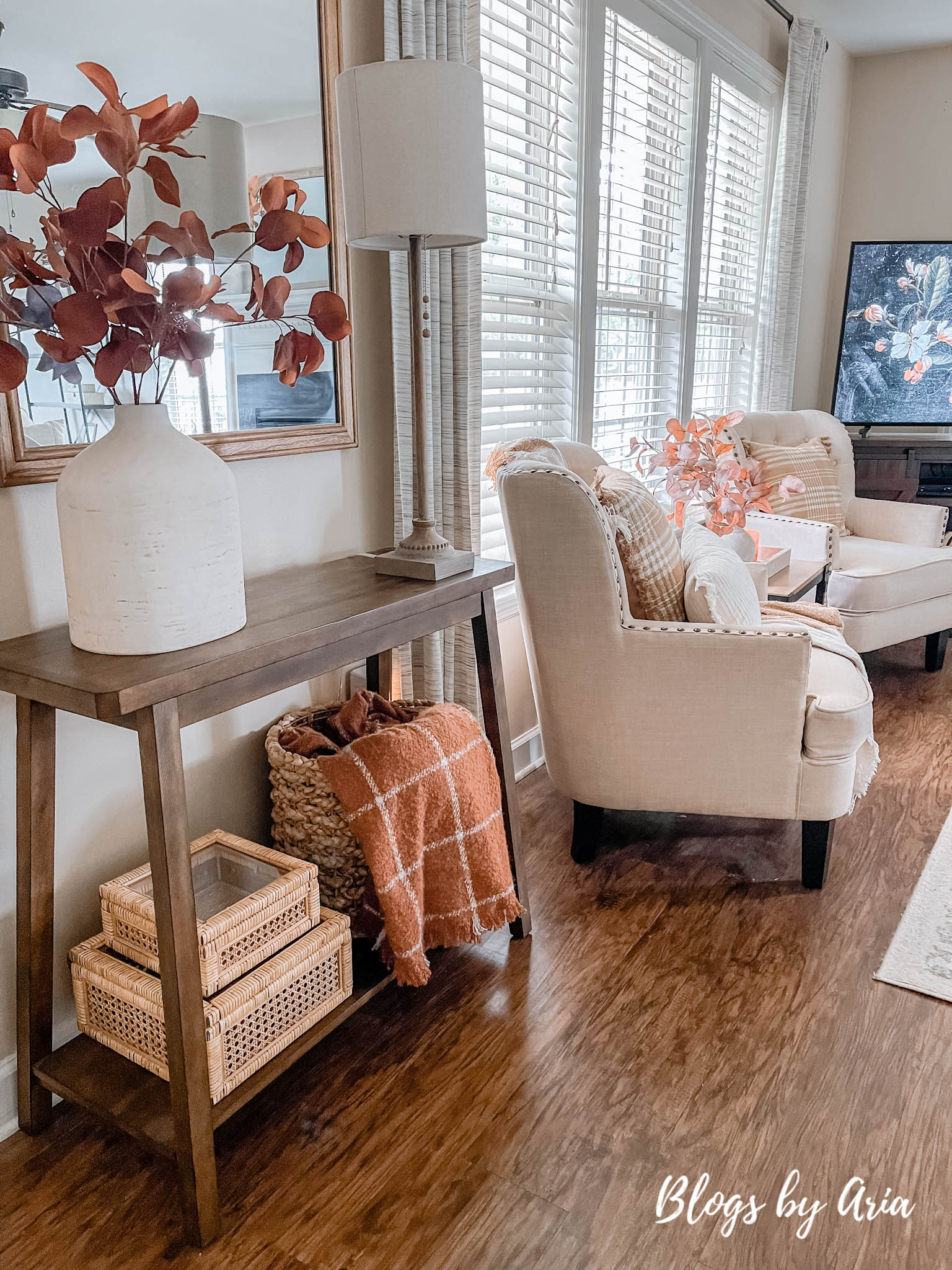 fall entryway small space entryway decorating for Fall with cream vase filled with beautiful brown stems and window pane fall throw blanket in basket