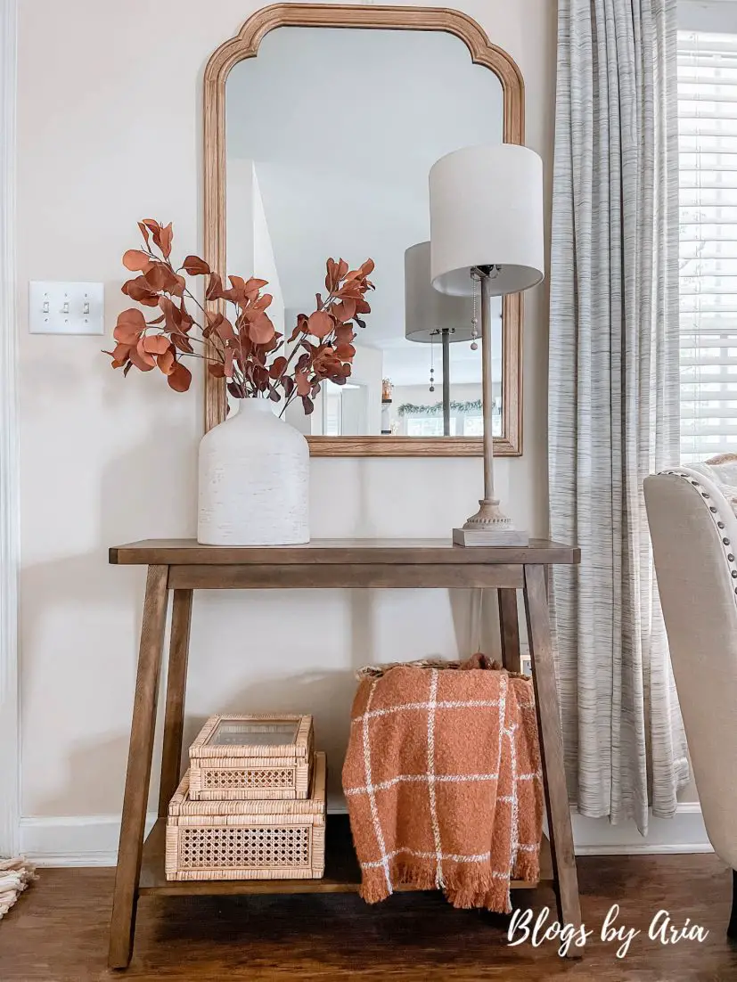 fall entryway small space entryway decorating for Fall with cream vase filled with beautiful brown stems and window pane fall throw blanket in basket