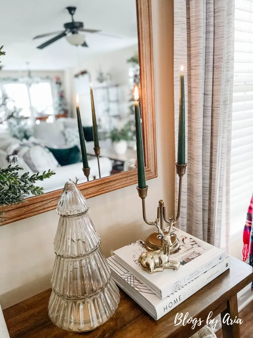 neutral Christmas entryway with green, gold and a pop of red