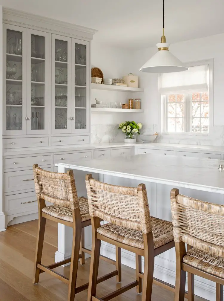 white kitchen with built in hutch and floating shelves