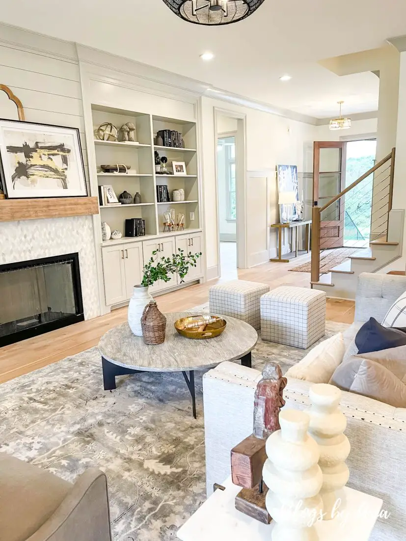 Darch Manor parade of homes tour modern farmhouse living room with built in shelves flanking fireplace