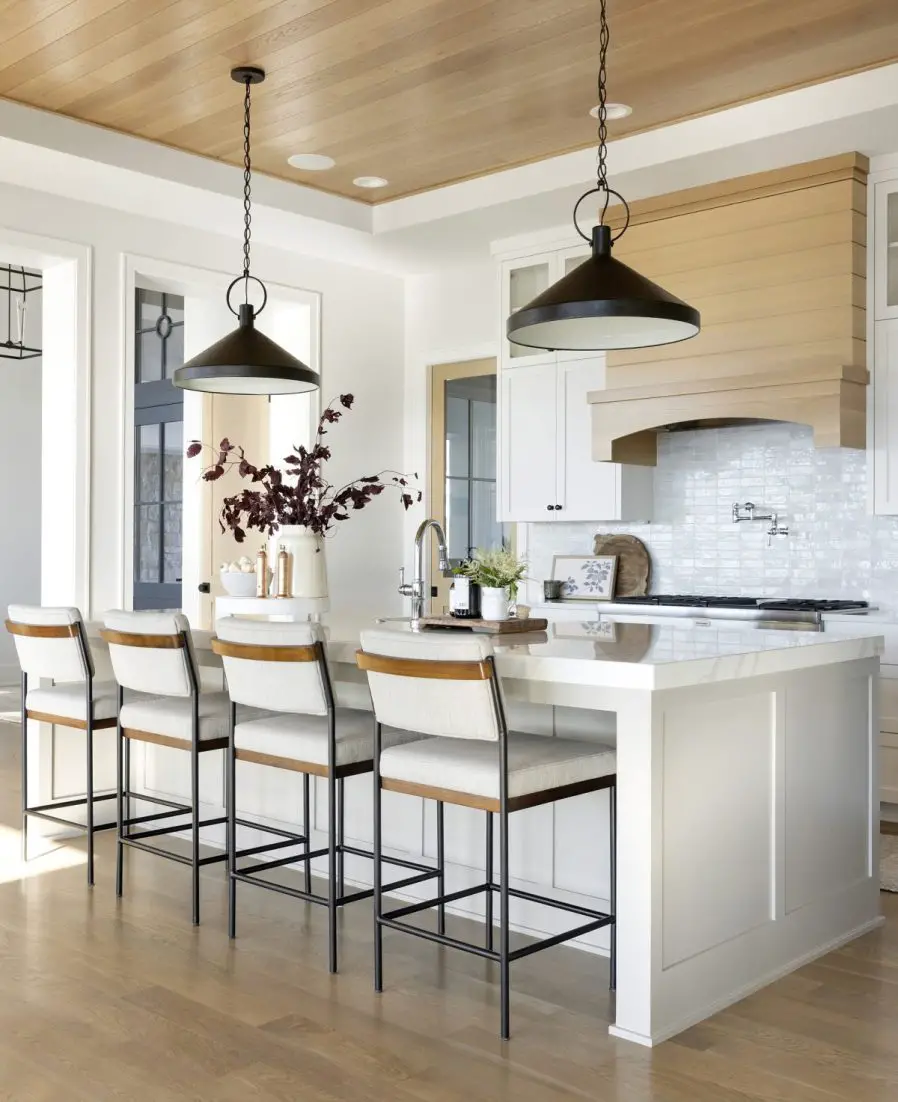 kitchen design with modern organic touches and black pendants